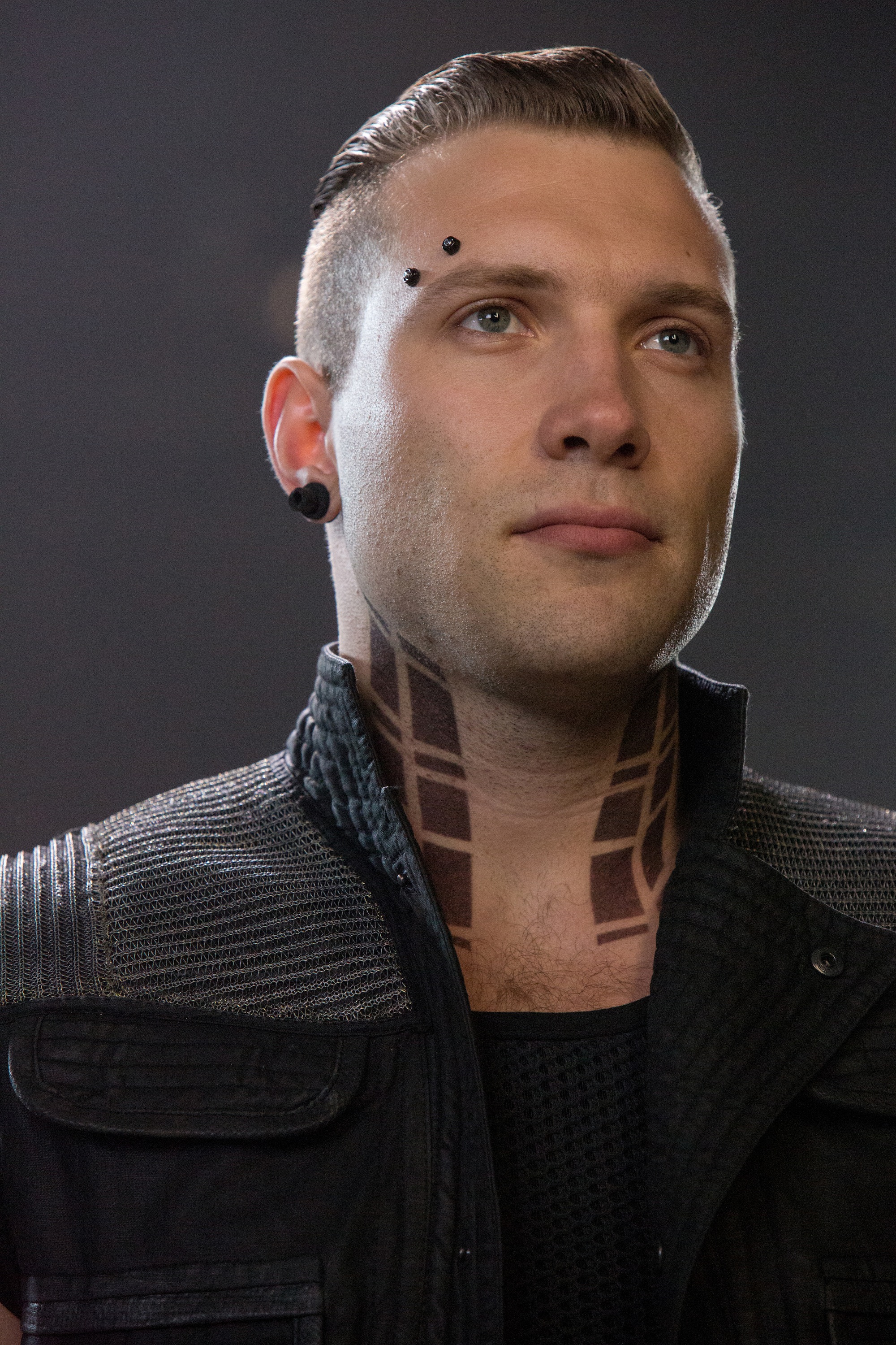 As Eric, Jai Courtney makes eyebrow piercings actually look cool. [Summit Entertainment via DivergentFaction]